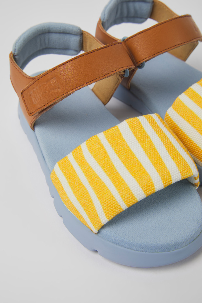 Close-up view of Oruga Multicolored textile and leather sandals for kids