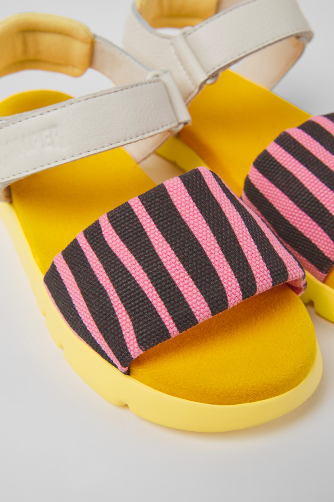 Close-up view of Oruga Multicolored textile and leather sandals for kids