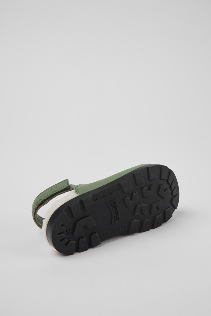 The soles of Brutus Green leather clogs for kids