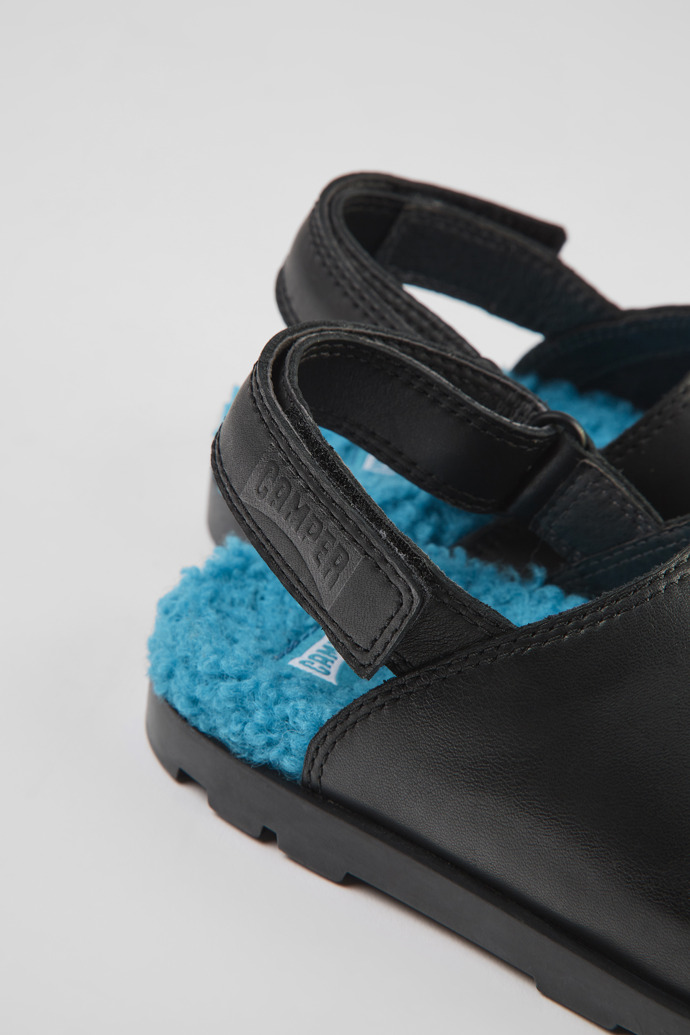Close-up view of Brutus Black leather clogs for kids