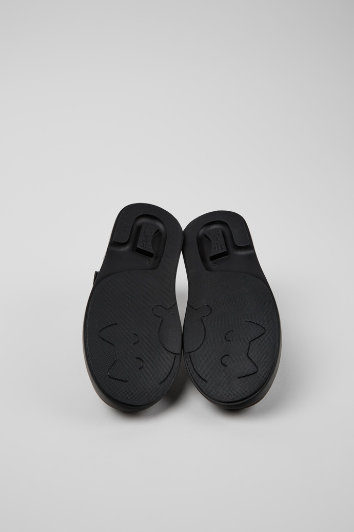 The soles of Twins Black leather Mary Jane shoes for kids