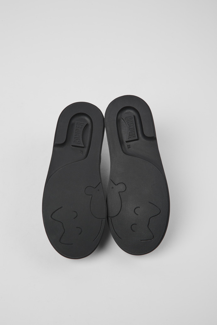 The soles of Twins Black leather Mary Jane shoes for kids