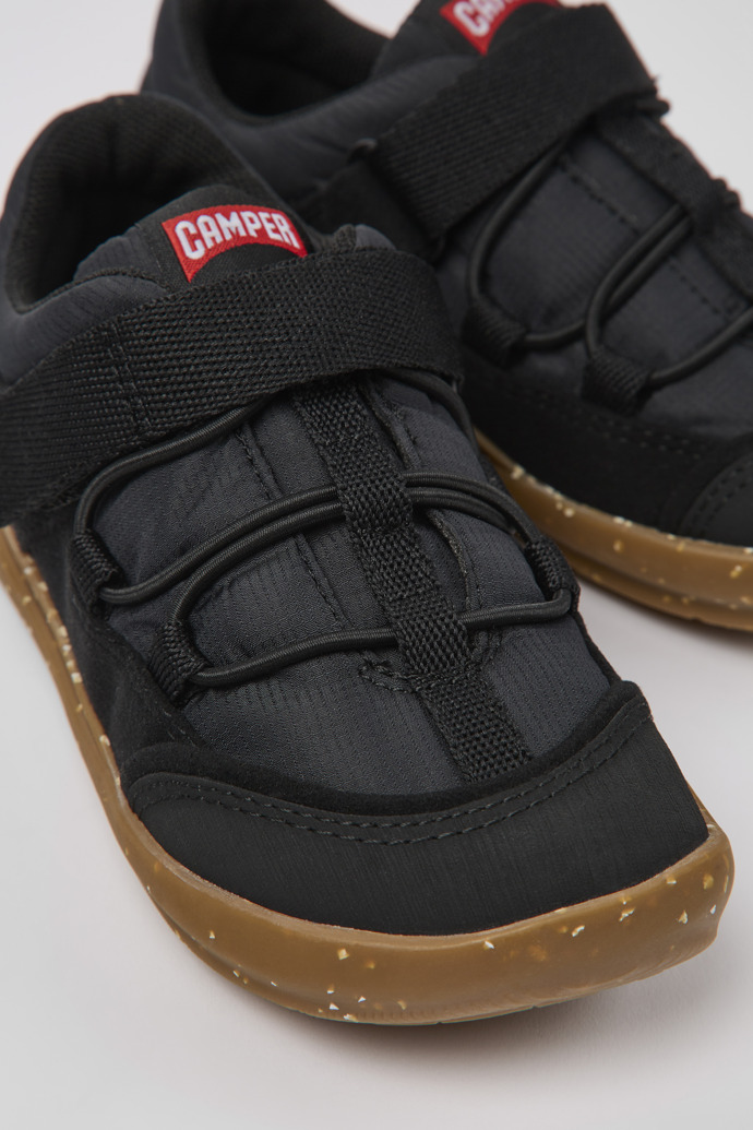 Close-up view of Ergo Black textile shoes for kids