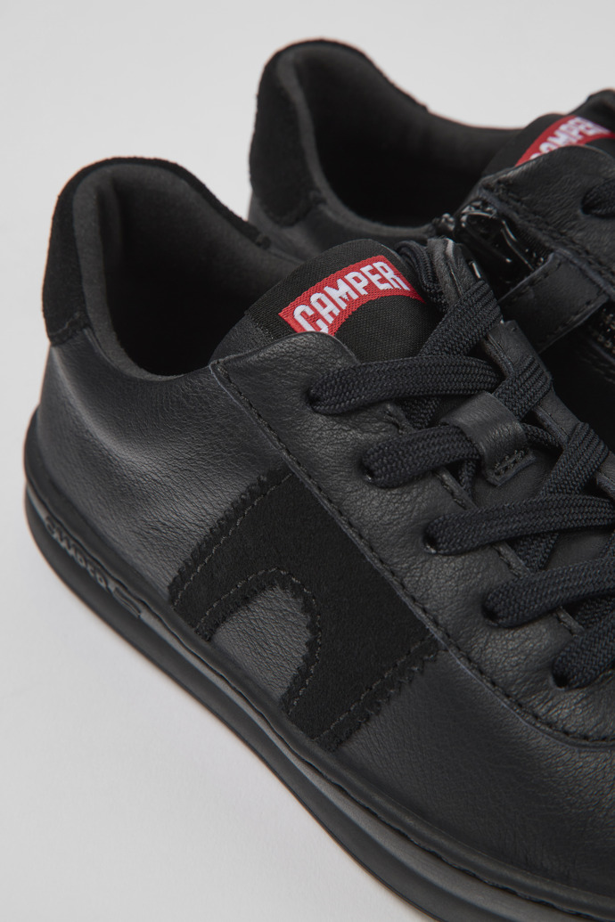Close-up view of Runner Black leather and nubuck sneakers for kids