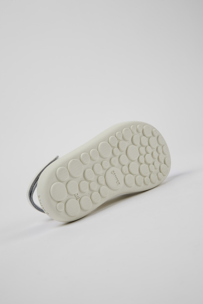 The soles of Pelotas Flota White Leather X-Strap Sandal