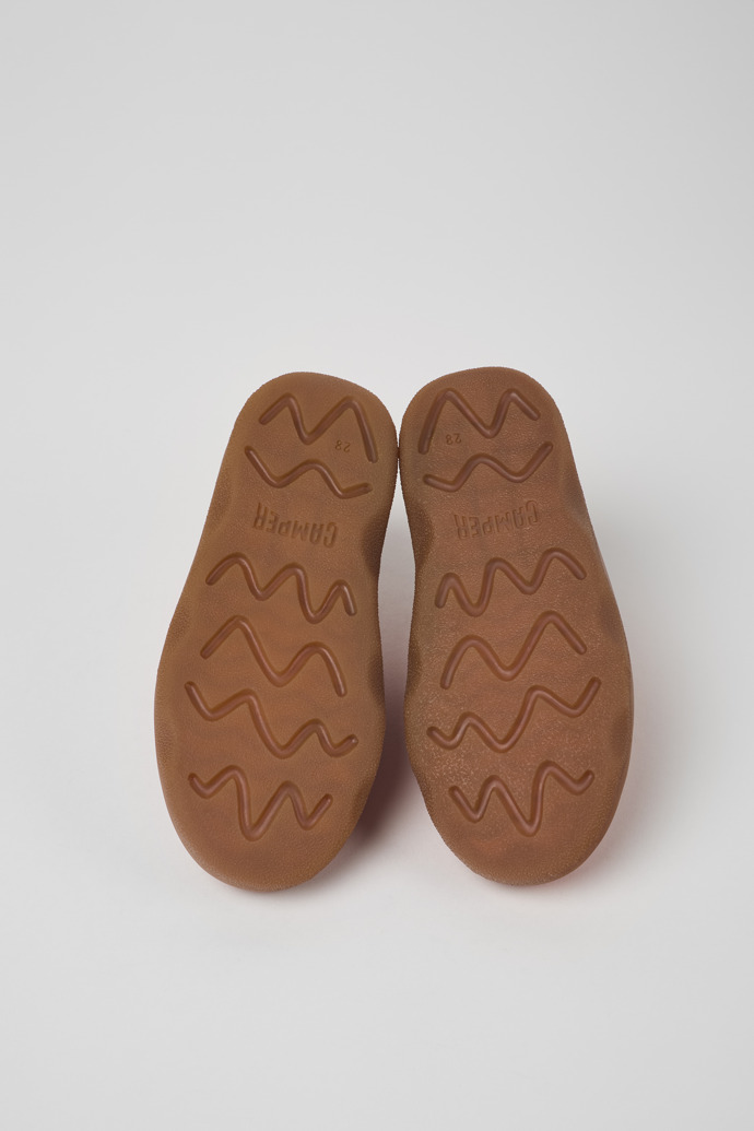 The soles of Kiddo Orange leather shoes for kids