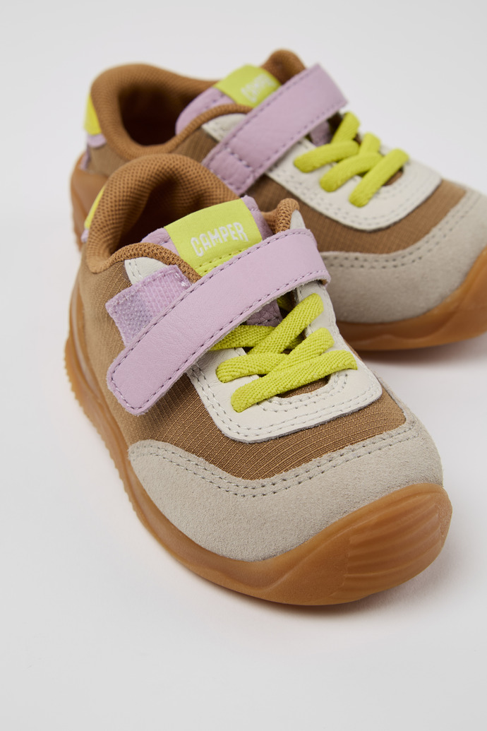 Close-up view of Dadda Brown textile and leather sneakers for kids