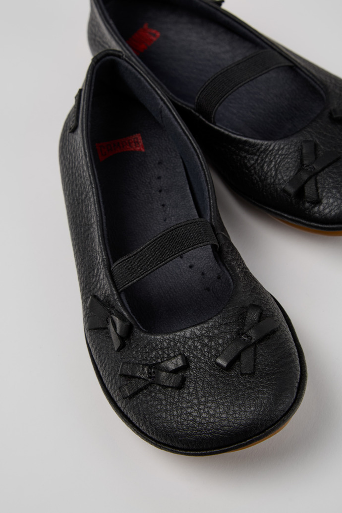 Close-up view of Twins Black Leather Ballerinas for Kids.