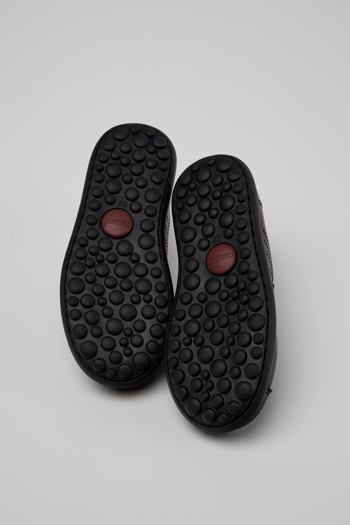 The soles of Pelotas Black Leather Shoes for Children.