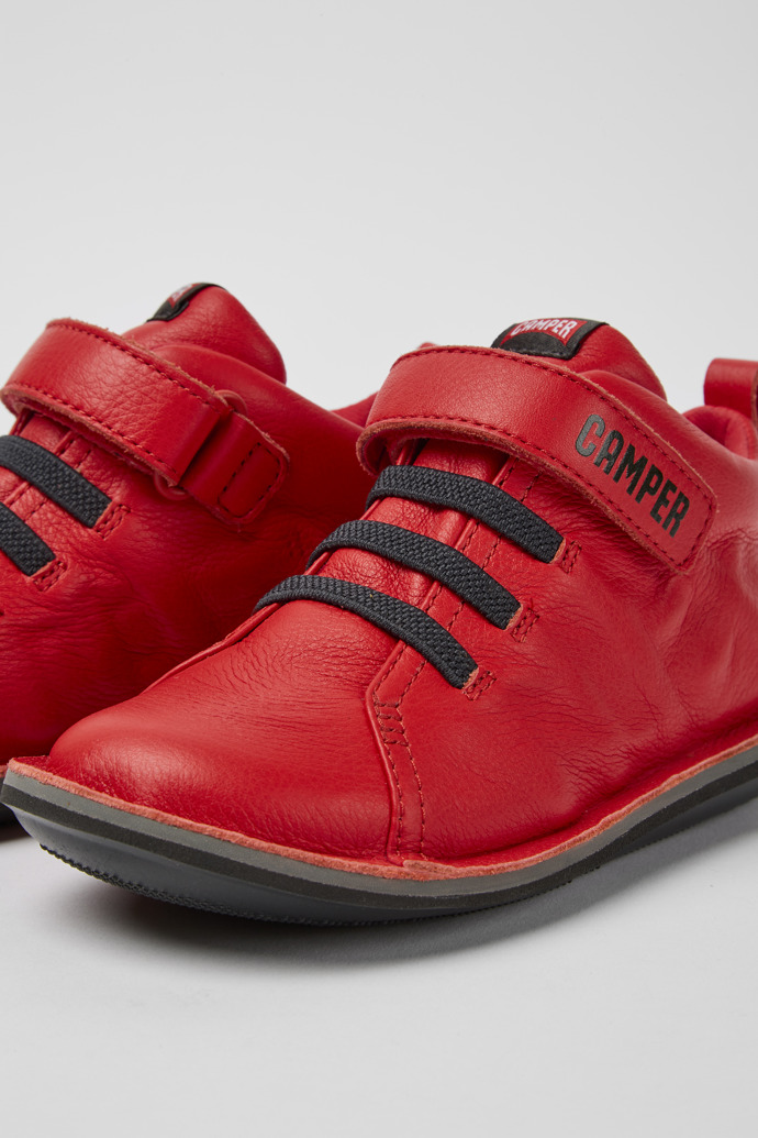 Close-up view of Beetle Red leather boots