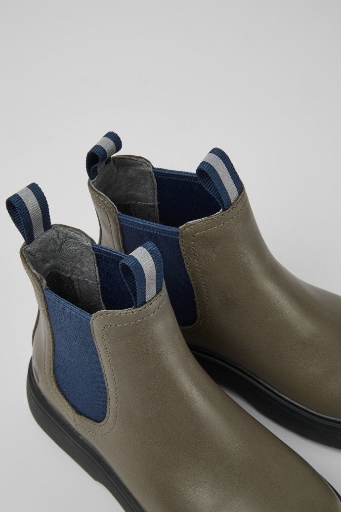 Close-up view of Norte Gray and blue ankle boots