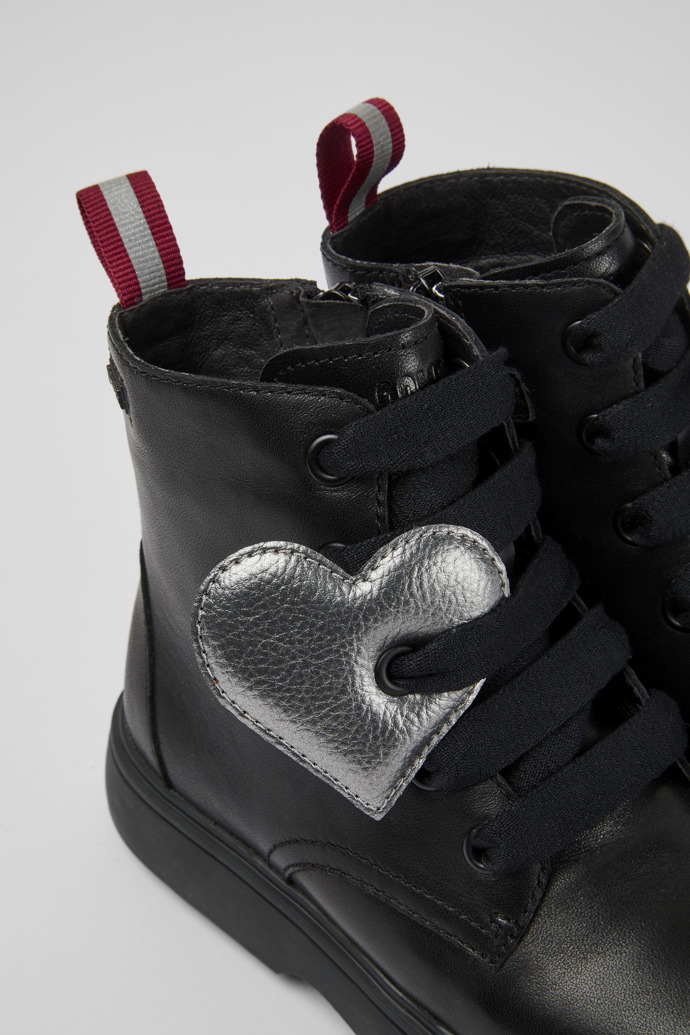 Close-up view of Norte Black lace-up ankle boots