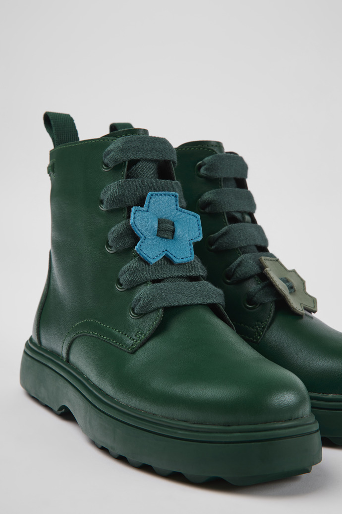 Close-up view of Twins Green leather ankle boots for kids