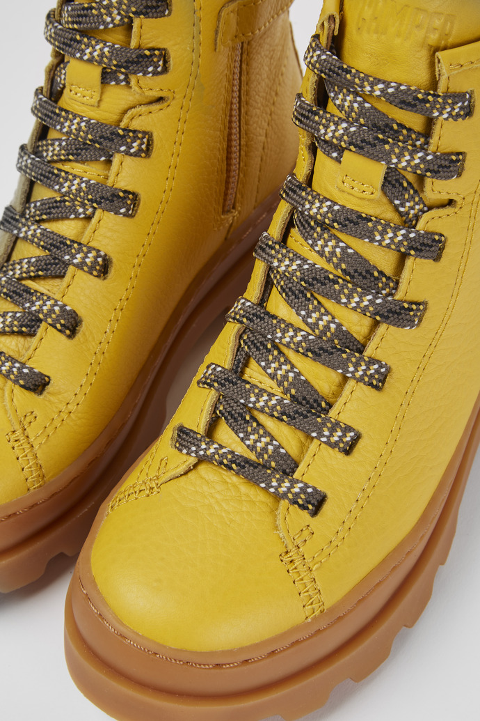 Close-up view of Brutus Yellow lace up leather boots