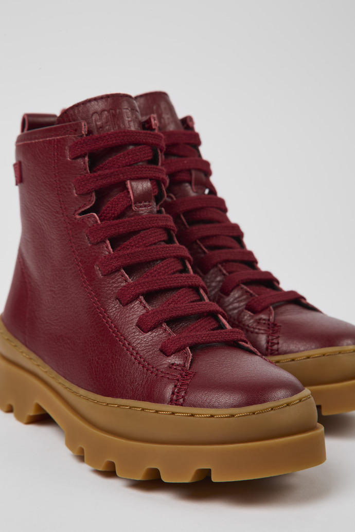 Close-up view of Brutus Burgundy leather lace-up boots