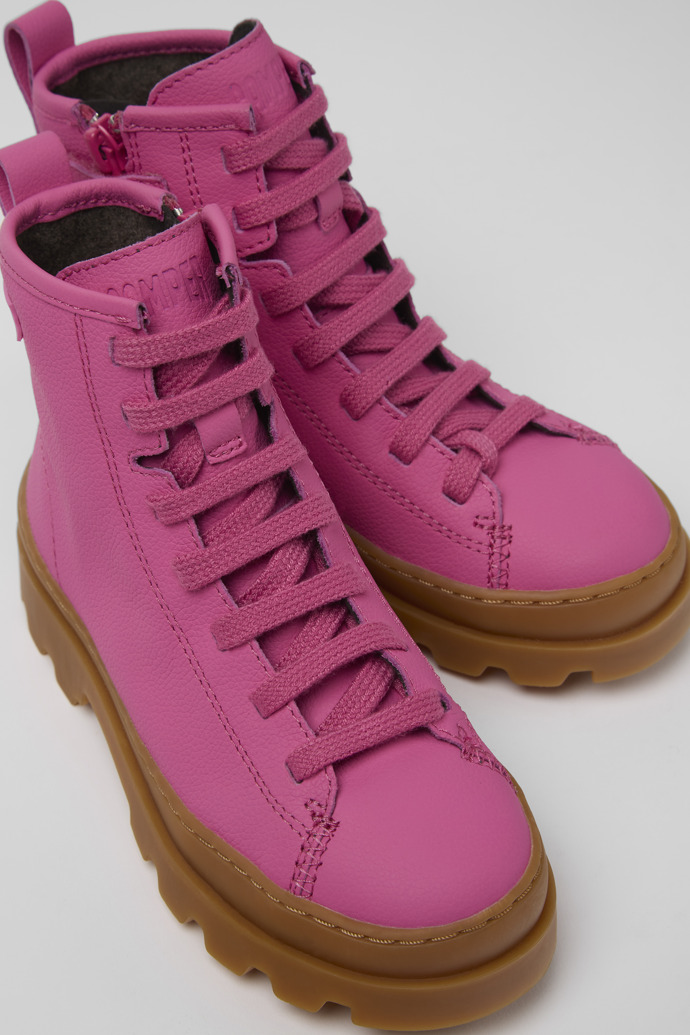 Close-up view of Brutus Pink leather lace-up boots