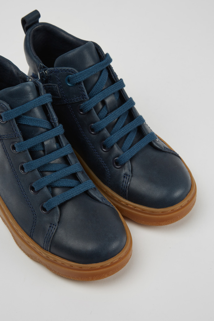 Close-up view of Kido Blue leather ankle boots