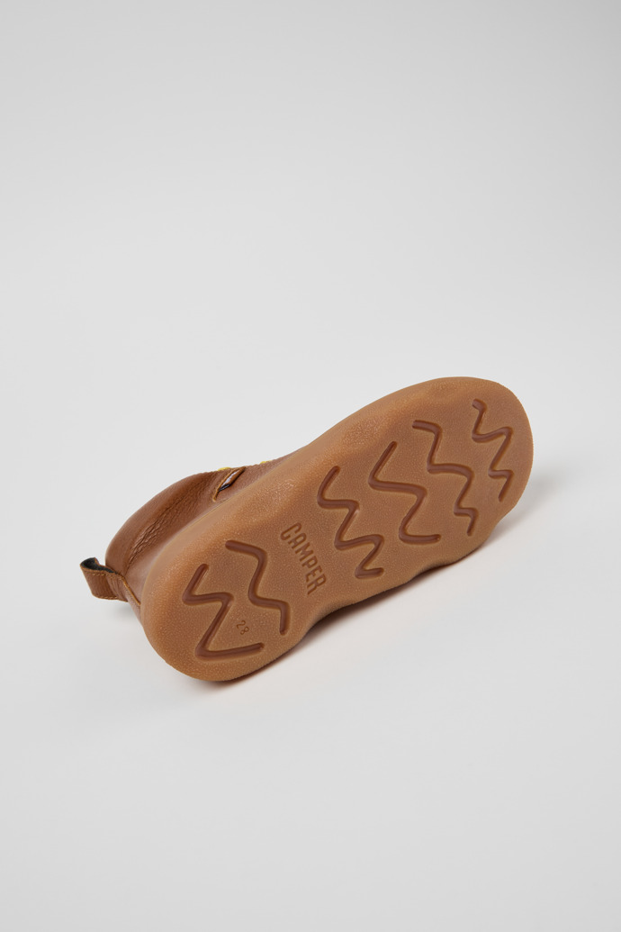 The soles of Kiddo Brown Leather Ankle Boots for Kids.