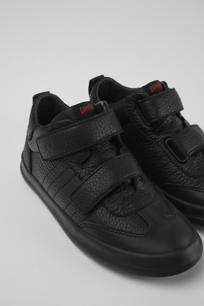 Close-up view of Pursuit Black leather and textile sneakers for kids