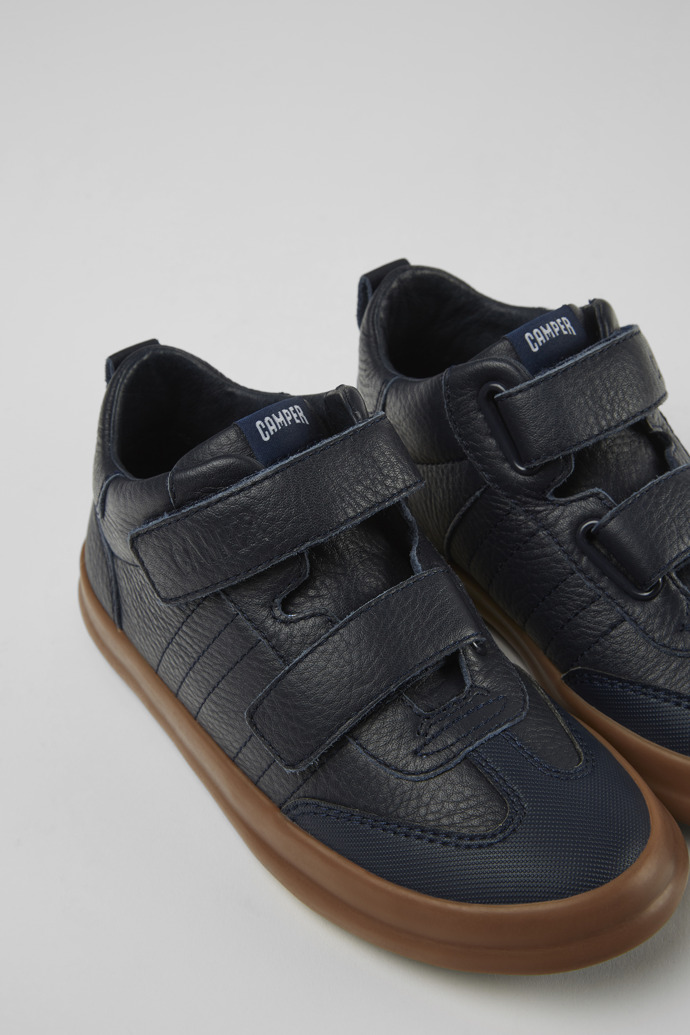 Close-up view of Pursuit Blue leather and textile sneakers for kids