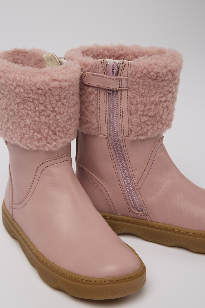 Close-up view of Kido Pink leather boots