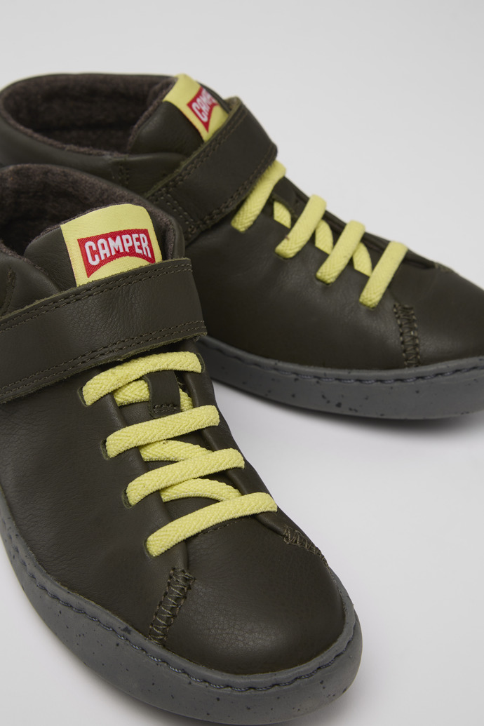 Close-up view of Peu Touring Green leather boots