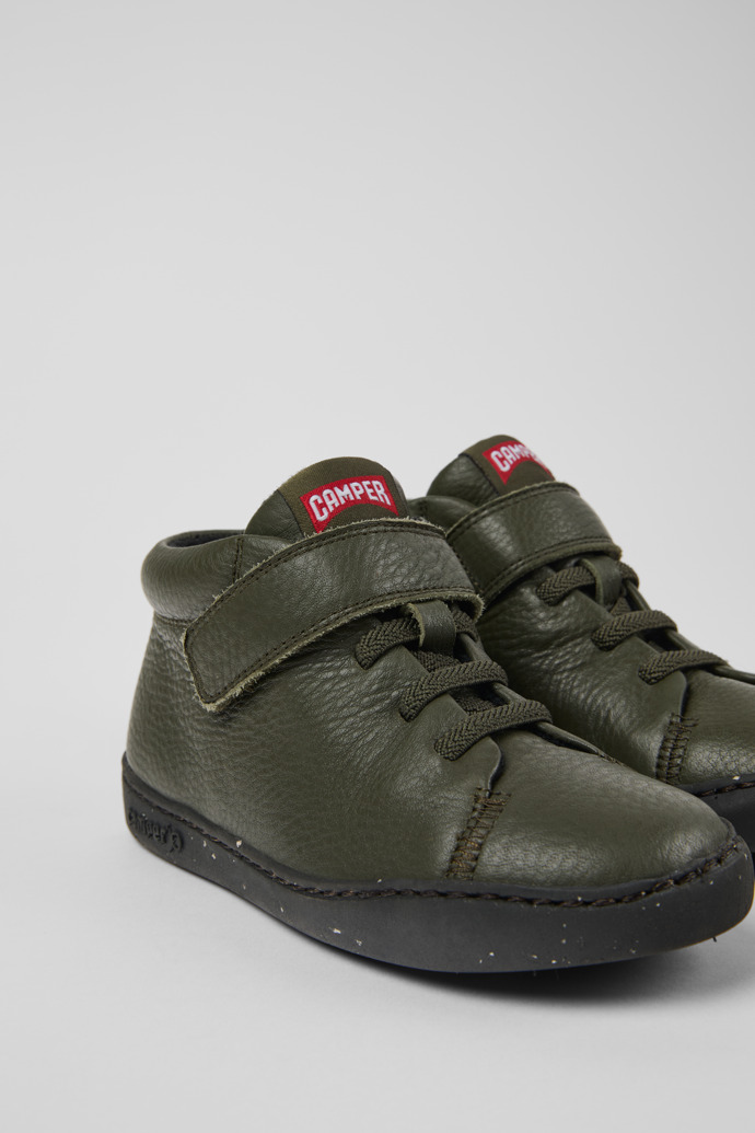 Close-up view of Peu Touring Green leather ankle boots for kids