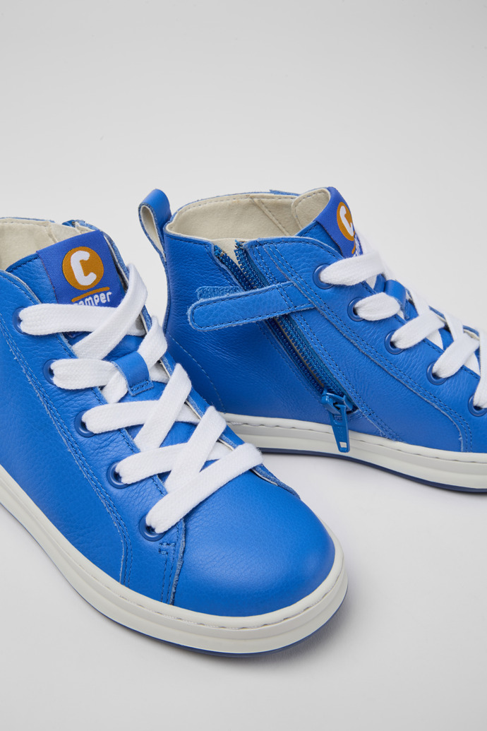 Close-up view of Runner Blue leather high-top sneakers for kids