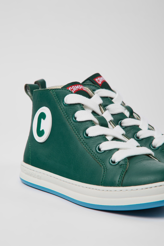 Close-up view of Runner Green leather sneakers for kids