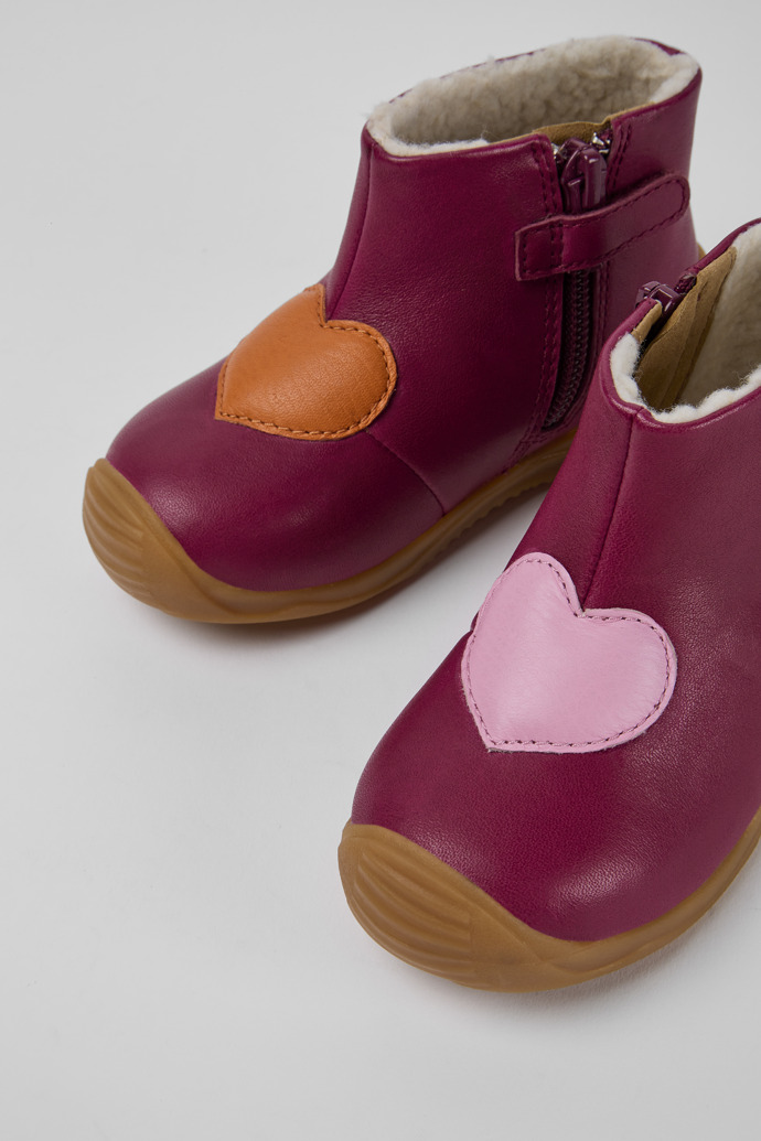 Close-up view of Twins Pink leather ankle boots