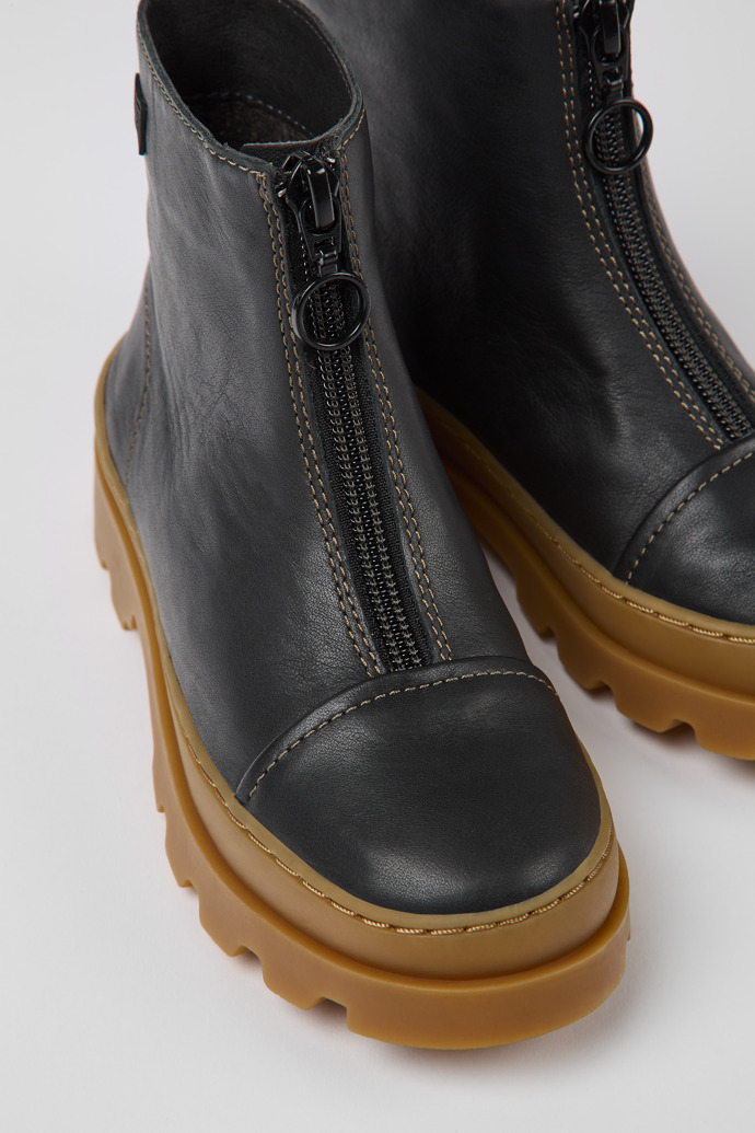 Close-up view of Brutus Black leather zip-up boots