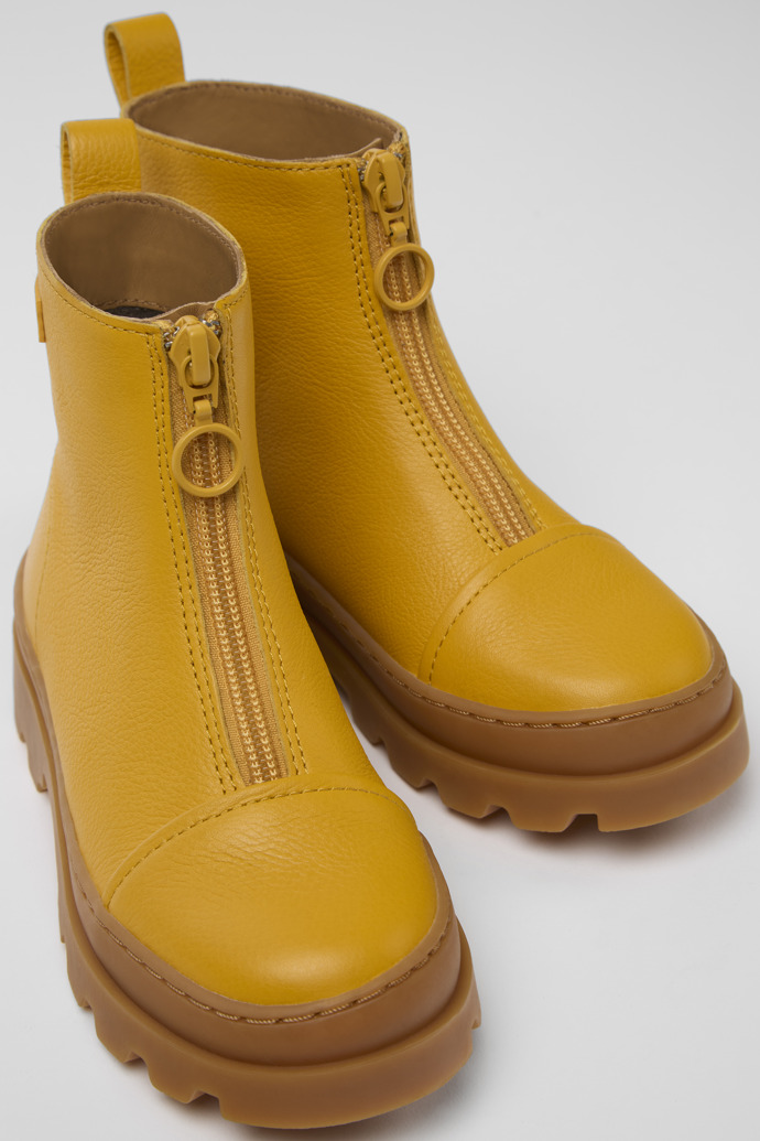 Close-up view of Brutus Yellow leather zip-up boots