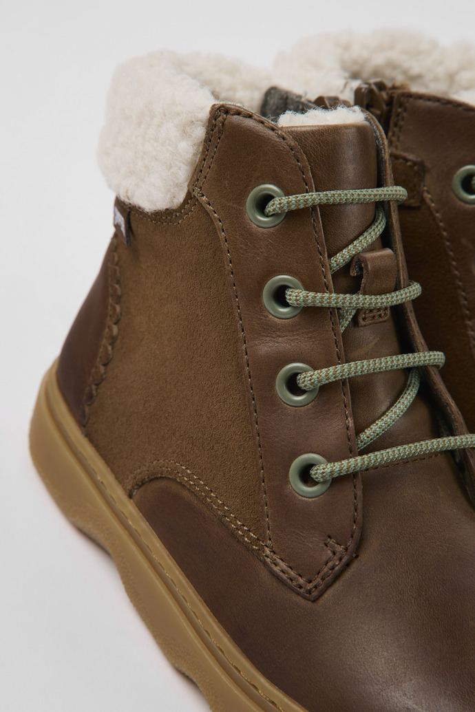Close-up view of Kido Brown leather and nubuck ankle boots for kids