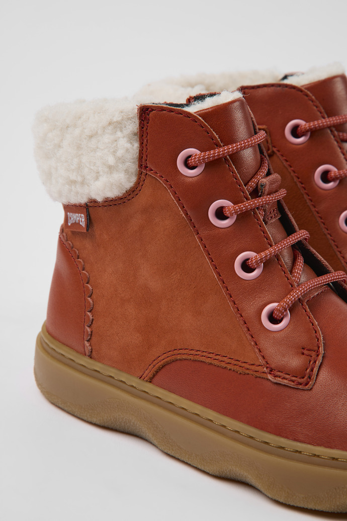 Close-up view of Kido Red leather and nubuck ankle boots for kids
