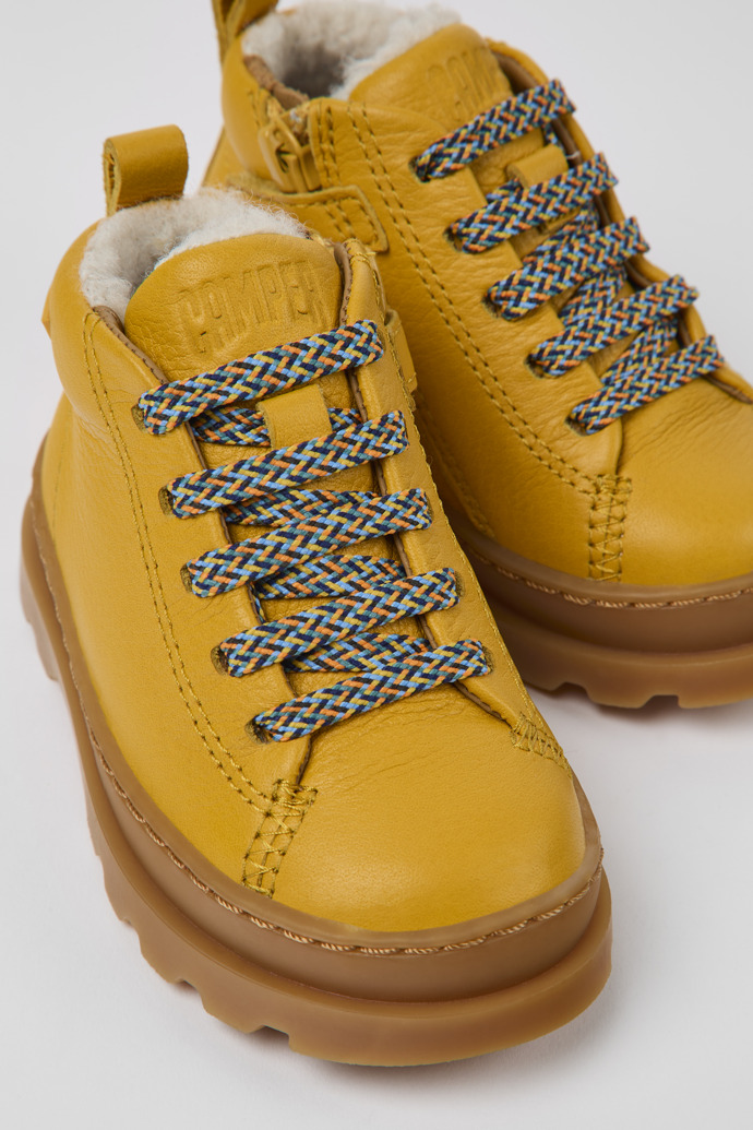 Close-up view of Brutus Yellow leather lace-up boots