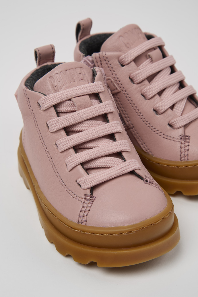 Close-up view of Brutus Pink leather ankle boots for kids