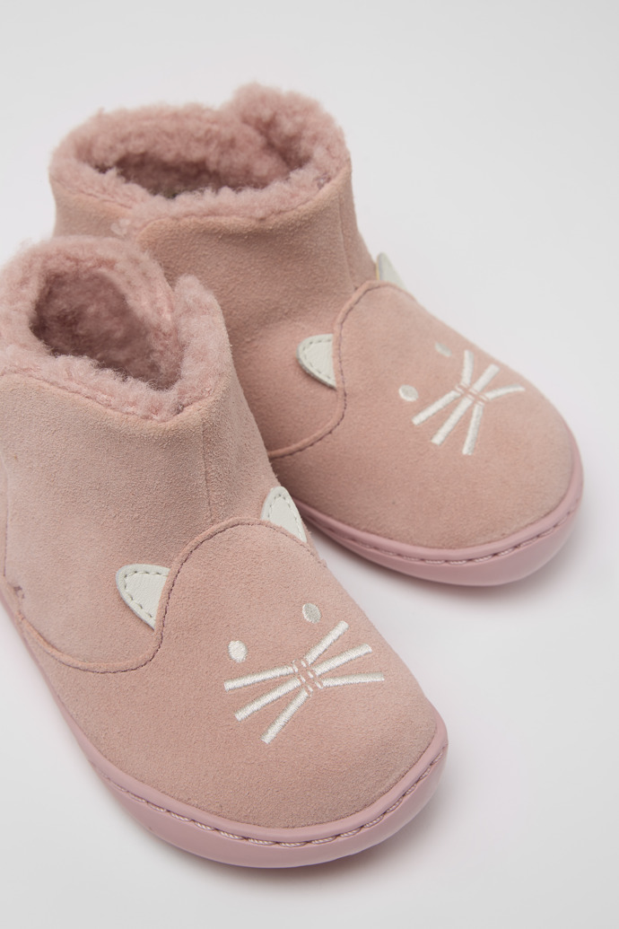 Close-up view of Twins Pink nubuck boots