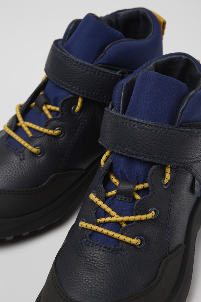 Close-up view of CRCLR Blue leather and textile ankle boots