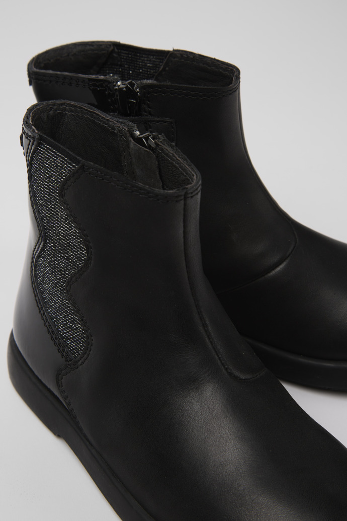 Close-up view of Duet Black leather boots