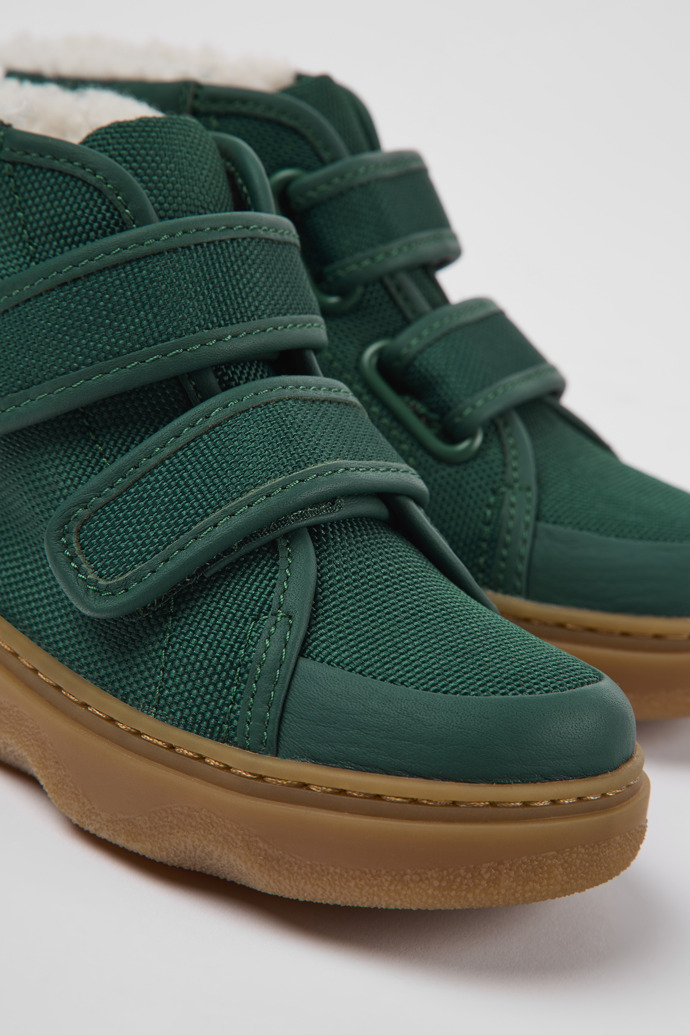 Close-up view of Kido Green leather and textile ankle boots for kids