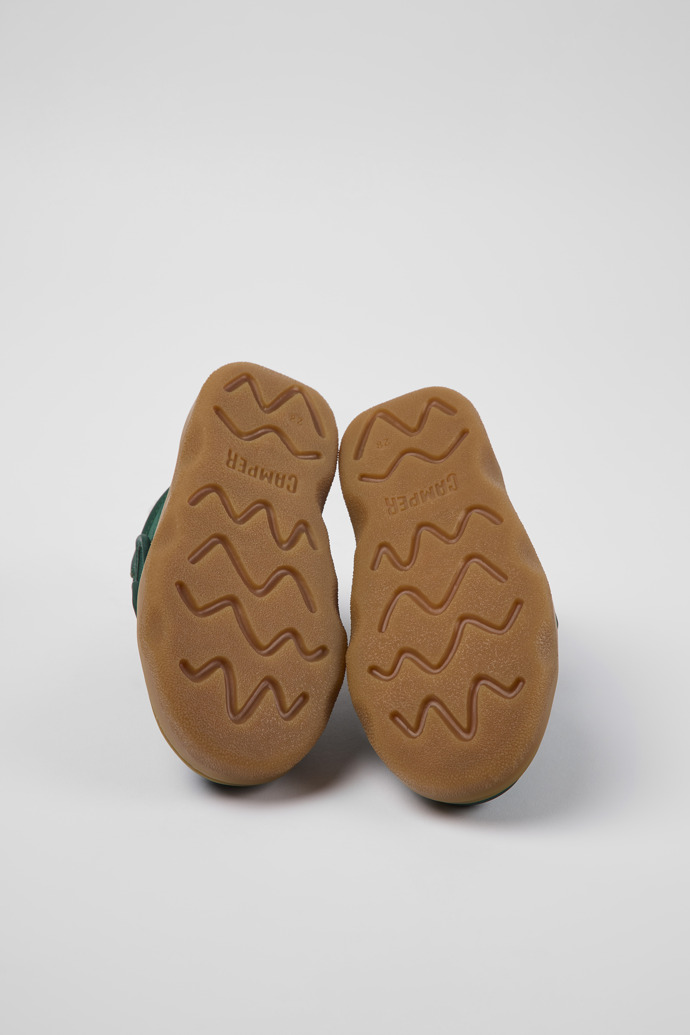 The soles of Kido Green leather and textile ankle boots for kids
