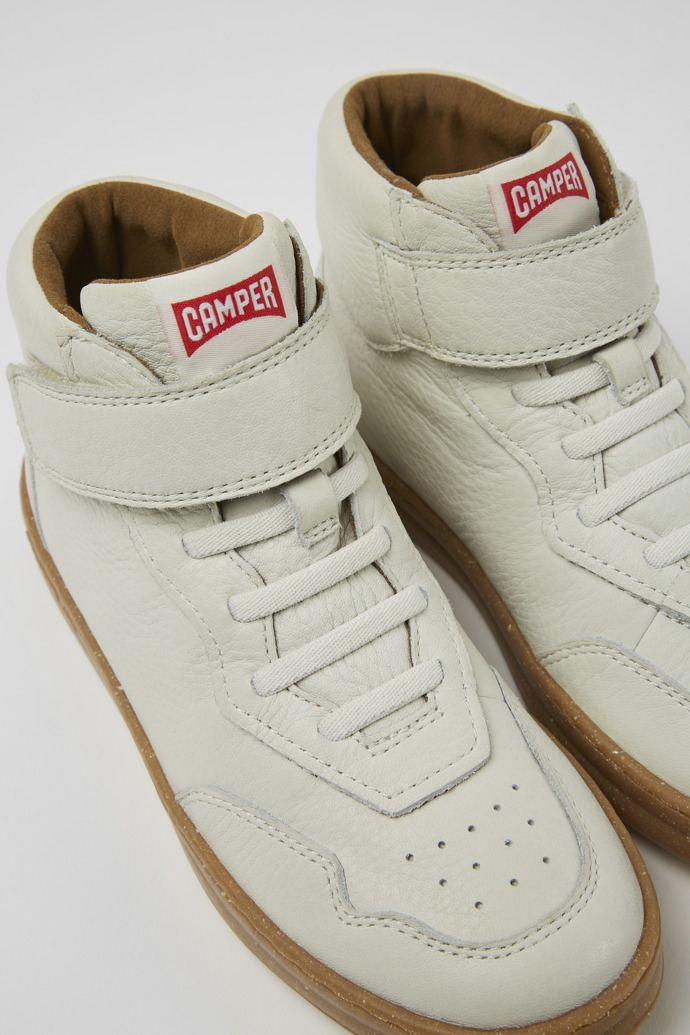 Close-up view of Runner White non-dyed leather sneakers