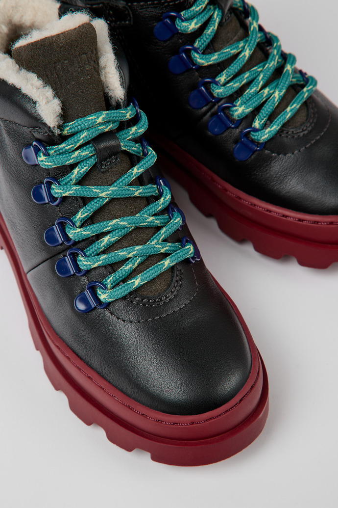Close-up view of Brutus Black leather and nubuck lace-up boots