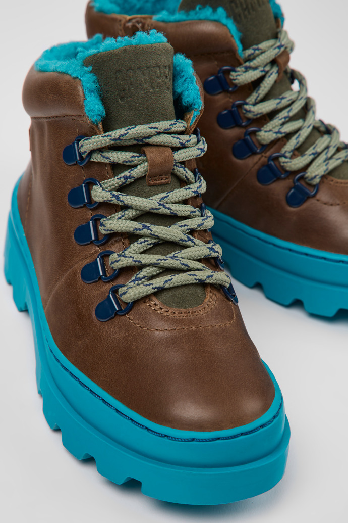 Close-up view of Brutus Brown leather and textile ankle boots for kids