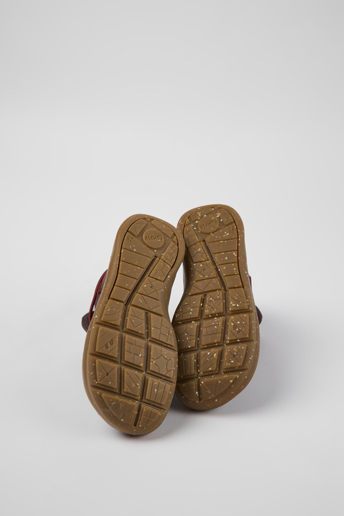 The soles of Ergo Brown textile ankle boots for kids