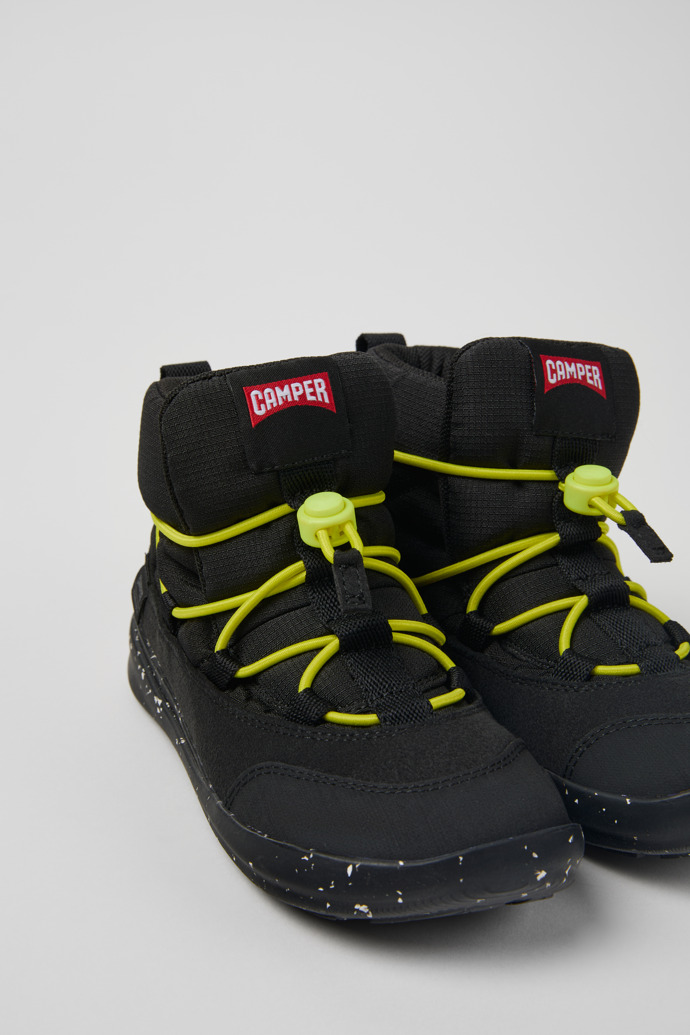 Close-up view of Ergo Black textile ankle boots for kids