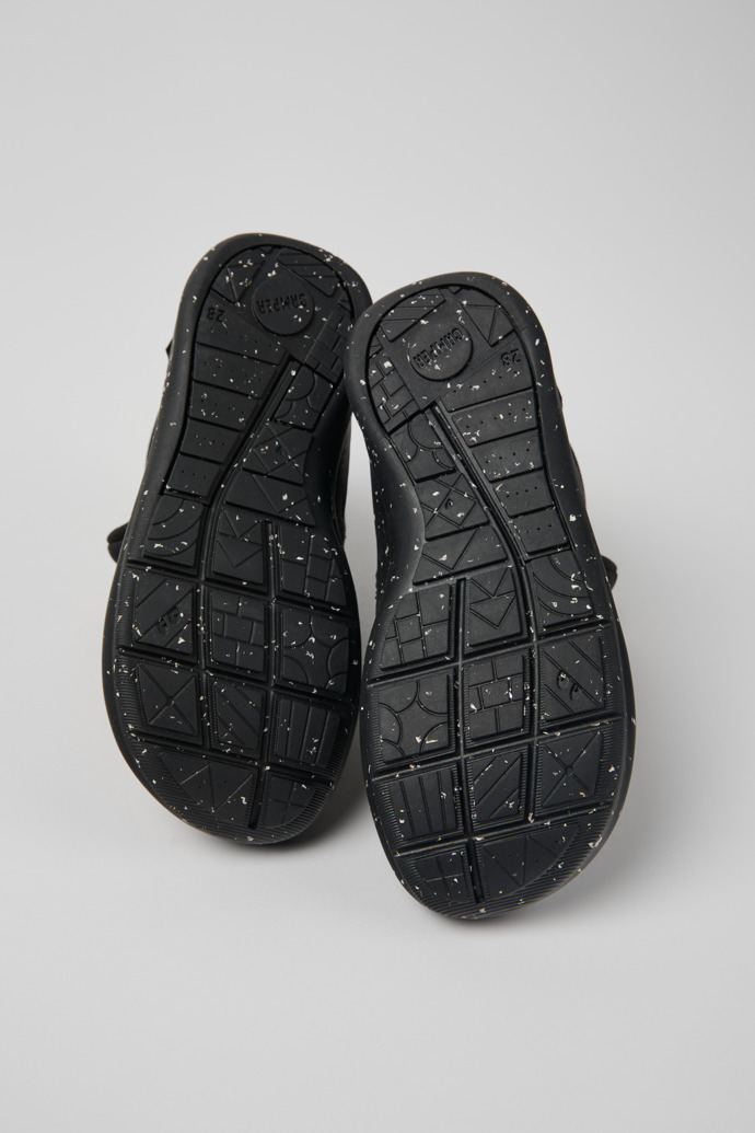 The soles of Ergo Black textile ankle boots for kids