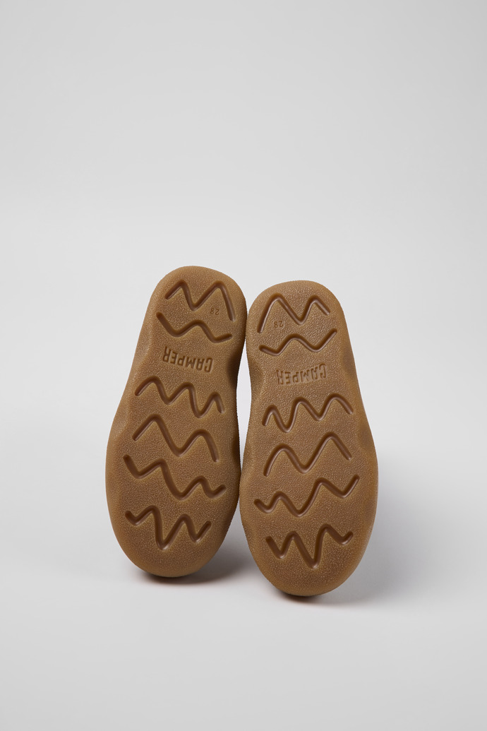 The soles of Kido Brown leather and nubuck boots for kids