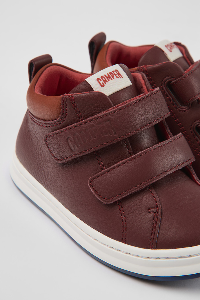 Close-up view of Runner Burgundy leather sneakers for kids