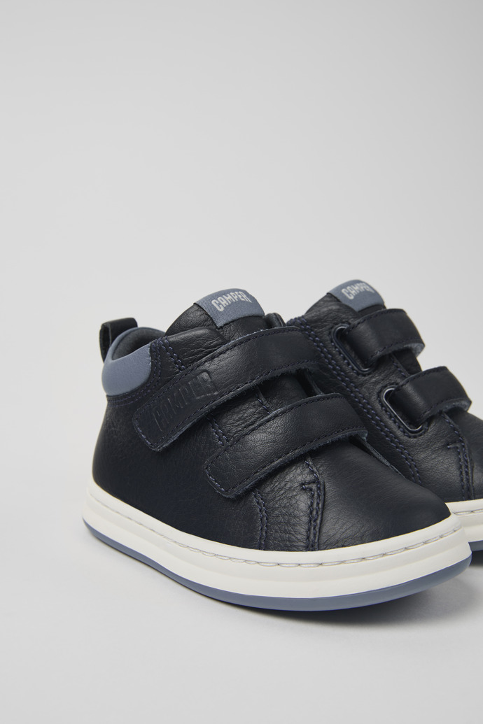 Close-up view of Runner Blue and gray leather sneakers for kids